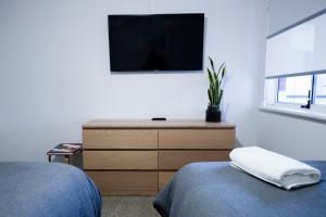 
A television and/or entertainment center at FortyTwo - Oceanside Retreat Busselton
