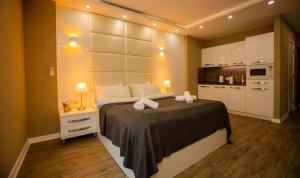 Postel nebo postele na pokoji v ubytování Aparthotel Holiday Lux Batumi