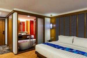 Postel nebo postele na pokoji v ubytování Lavana Hotel Chiangmai