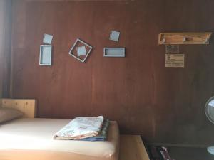 Postel nebo postele na pokoji v ubytování ซอยห้า โฮมสเตย์ เชียงคาน