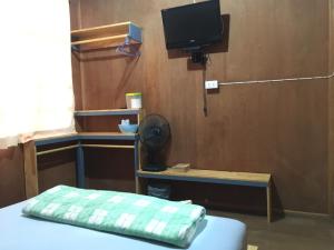 Postel nebo postele na pokoji v ubytování ซอยห้า โฮมสเตย์ เชียงคาน