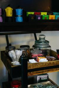 a shelf with jars and other items on it at Villa Carmel Boutique Hotel in Haifa