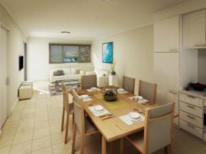 a living room filled with furniture and a table at Broadwater Mariner Resort in Geraldton