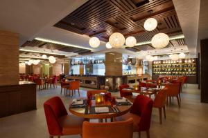 Ресторант или друго място за хранене в Royal Singi Hotel
