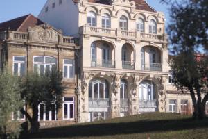 an old building with a turret on a hill at Oporto Centre Clean & Cozy Apt 1 in Porto