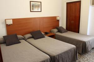 Postel nebo postele na pokoji v ubytování Hotel Jardín
