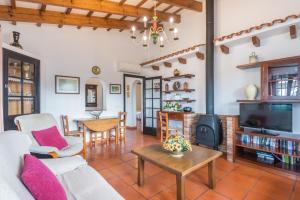 a living room with a couch and a table at Villa Sa Canova by Mauter Villas in Ciutadella