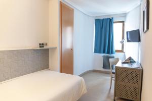 TV a/nebo společenská místnost v ubytování Hotel Alda Centro Palencia