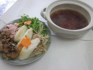 a plate of food with a bowl of soup and a salad at Shiunso in Nikko