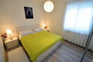 Postel nebo postele na pokoji v ubytování Apartment Kristina
