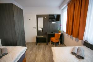 TV a/nebo společenská místnost v ubytování Apartments A7