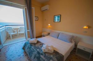 Postel nebo postele na pokoji v ubytování Hotel David