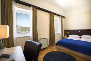 Posteľ alebo postele v izbe v ubytovaní Apartment ACI Marina CRES