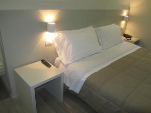 Posteľ alebo postele v izbe v ubytovaní Hotel Borgovico