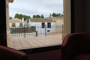 a view from a window of a building with a fence at El Retiro del Pilar in Belmonte