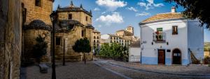 an old building and a building with a tower at La Maroma Rooms & Views in Alhama de Granada