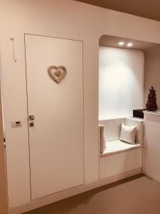 a room with a door with a heart on it at Maison Saint Honorè in Foggia