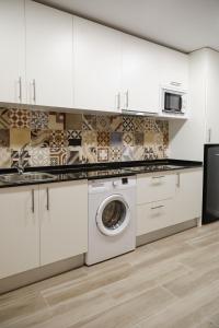 Kuchyň nebo kuchyňský kout v ubytování SM Apartments Station + 27 fotografií