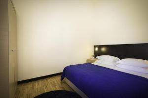 Posteľ alebo postele v izbe v ubytovaní Apartment ACI Marina CRES