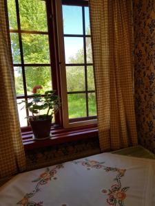 Postel nebo postele na pokoji v ubytování Vargheden B&B och trädgård