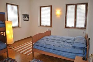 Lova arba lovos apgyvendinimo įstaigoje Appartamenti Palazzo Lazzaris - Costantini - Dolomiti del Cadore