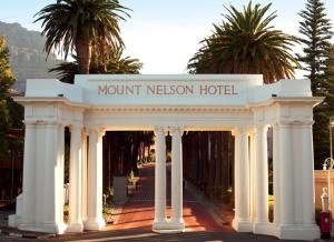a white archway with a hotel sign on it at Mount Nelson, A Belmond Hotel, Cape Town in Cape Town