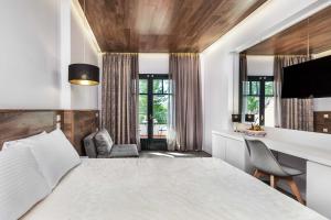 Postel nebo postele na pokoji v ubytování Atrium Hotel