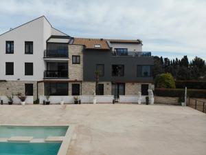 an exterior view of a house with a swimming pool at Penthouse No6 in Medulin