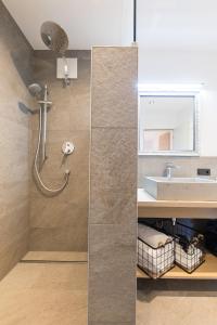 a bathroom with a shower and a sink at Easy Living Apartment Ötztal in Sautens