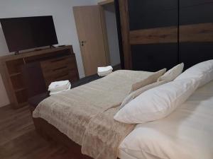 Posteľ alebo postele v izbe v ubytovaní Apartmán Martin