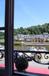 a view from a window of a marina with boats at Le Poisson Ivre in Dinan