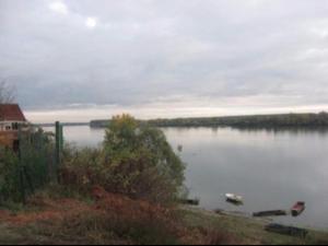 a view of a lake with boats in the water at Dunav97 in Novi Banovci