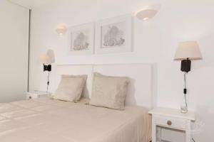 Giường trong phòng chung tại OCEAN TERRACES VILA GAIVOTA J