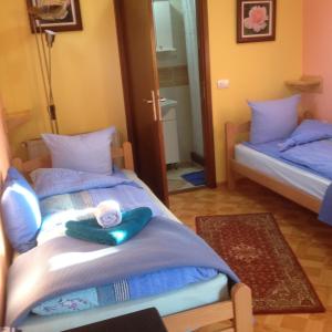 Postel nebo postele na pokoji v ubytování Guest House Rose