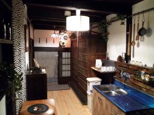 a kitchen with a sink and a counter top at Kyoto Villa Ninja in Kyoto