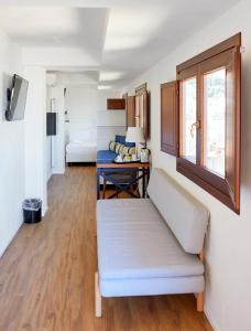 a living room with a couch and a table at Sopra Le Mura in Castellammare del Golfo