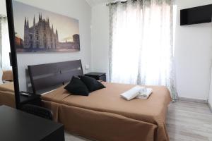 A bed or beds in a room at Guest House Minas
