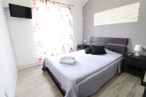 A bed or beds in a room at Guest House Minas