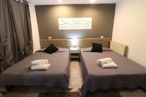 A bed or beds in a room at Guest House Minas