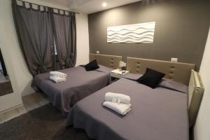 A bed or beds in a room at Guest House Minas