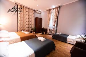 Postel nebo postele na pokoji v ubytování Hotel Aida