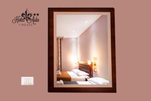 Postel nebo postele na pokoji v ubytování Hotel Aida