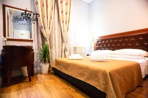 Postel nebo postele na pokoji v ubytování Hotel Aida