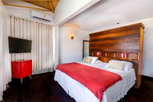 Postel nebo postele na pokoji v ubytování Vila Coqueiros Boutique Hotel