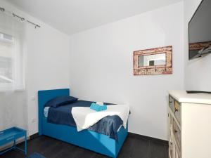 Postel nebo postele na pokoji v ubytování Deluxe Apartman Porto