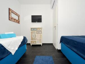 Postel nebo postele na pokoji v ubytování Deluxe Apartman Porto