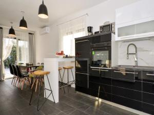 Kuchyň nebo kuchyňský kout v ubytování Deluxe Apartman Porto