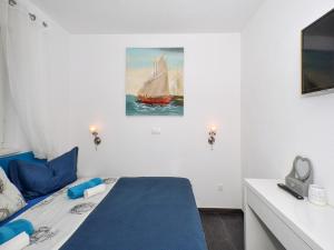 Postel nebo postele na pokoji v ubytování Deluxe Apartman Porto