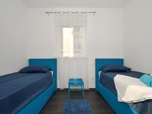 Postel nebo postele na pokoji v ubytování Deluxe Apartman Porto