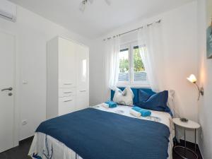 Postel nebo postele na pokoji v ubytování Deluxe Apartman Porto